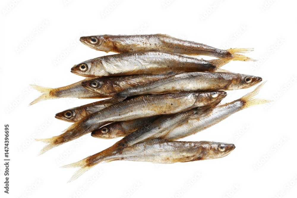 A pile of small, smoked fish on a white background. A pile of small, smoked fish on a white background.