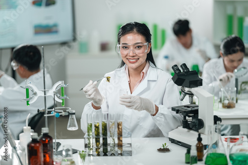 Scientists examining plant ...