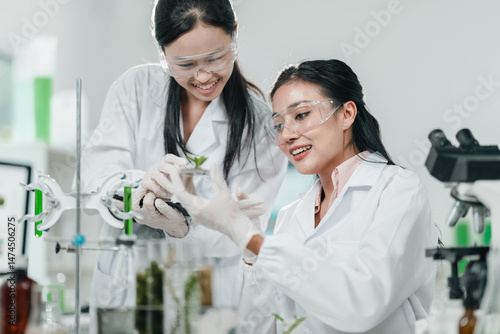 Scientists examining plant ...