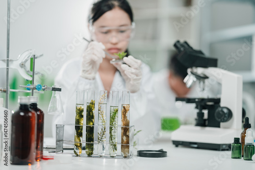 Scientists examining plant ...