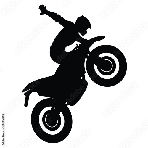Silhouette shows biker performing a wheelie trick; only the rear tire touches the ground