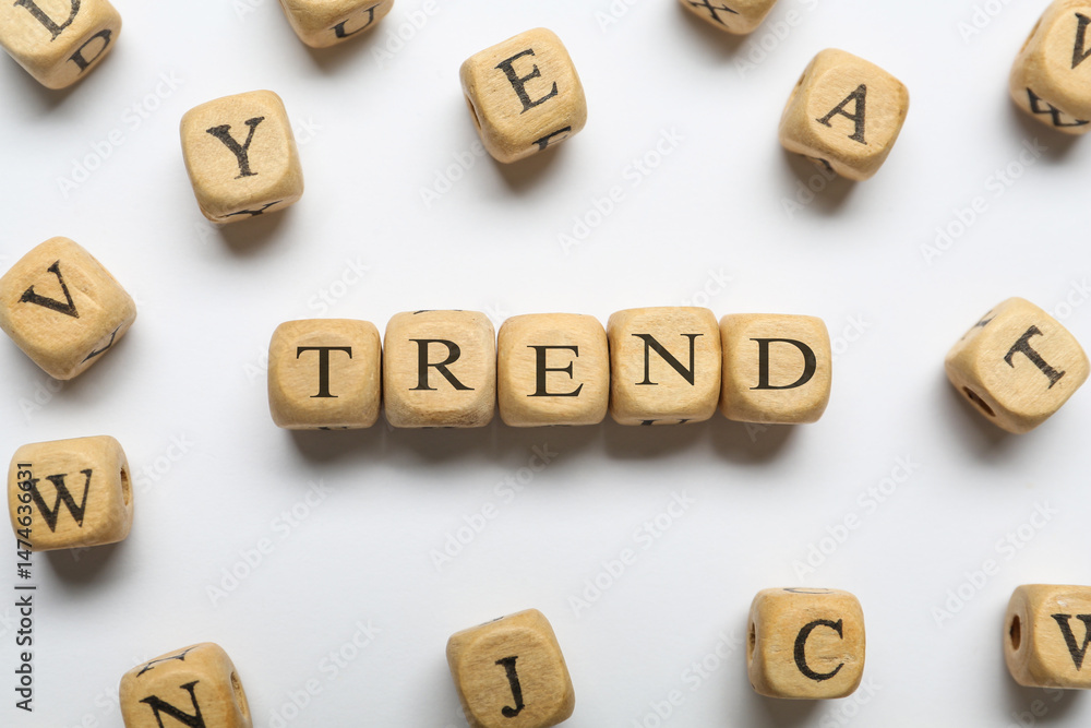 Word Trend made of wooden cubes with letters on white background, top view Word Trend made of wooden cubes with letters on white background, top view