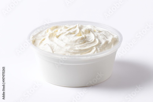 Creamy white dip in a plastic cup.