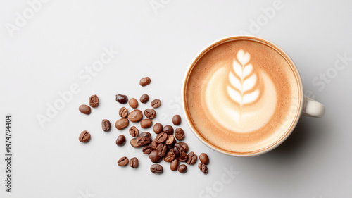 top view of coffee cup with latte art and scattered coffee beans creates warm and scene. rich colors and textures highlight beauty of coffee culture