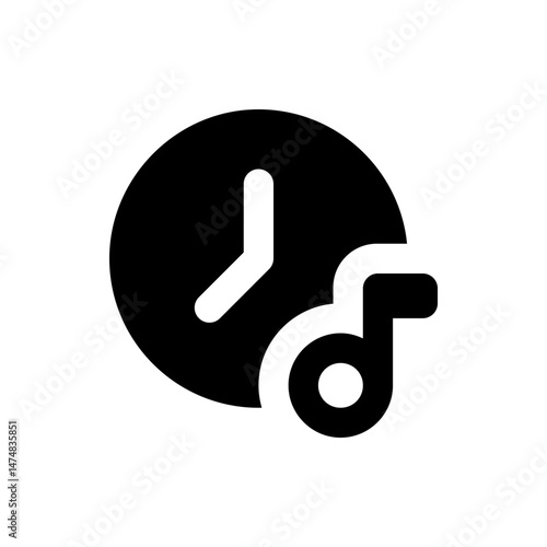 Black clock with white hands showing the time next to a musical note symbol on a white background view