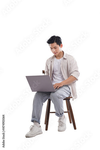 portrait of young asian man sitting on chair posing