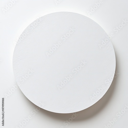 A plain, round, white disc.  Smooth, even surface