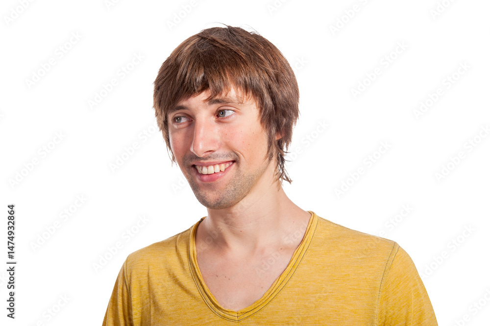Young man in a yellow shirt smiling against a white background Young man in a yellow shirt smiling against a white background
