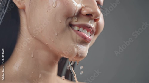 close up face of asian young woman with clear skin, water drops