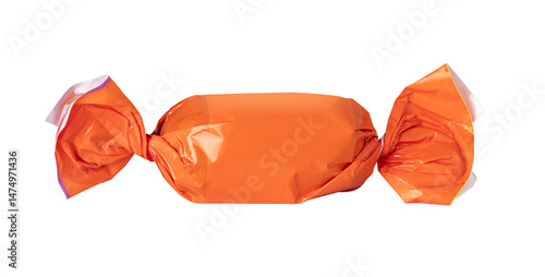 Obraz na płótnie Single orange wrapped candy on transparent background