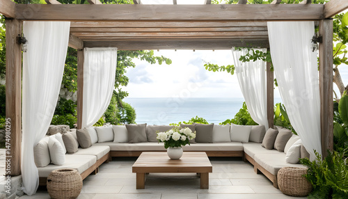 Obraz na płótnie Elegant outdoor lounge area with white curtains and ocean view for relaxation and tranquility. A serene outdoor lounge area with flowing white curtains and beautiful ocean view w salonie
