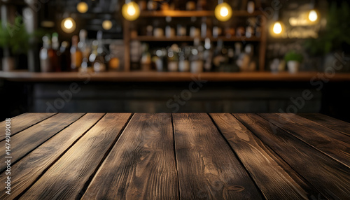 Obraz na płótnie Wooden bar counter with illuminated bottles on shelves in the background w salonie