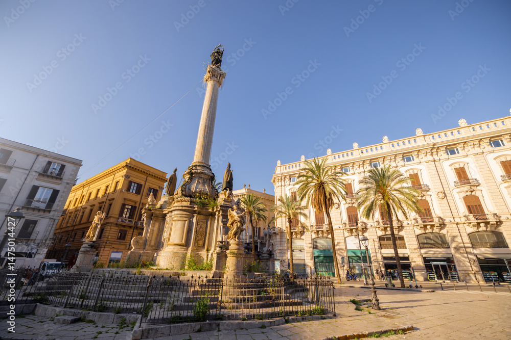 Obraz premium Early morning sun illuminates the column and baroque sculptures at Piazza San Domenico in Palermo, Sicily. This image captures timeless European charm, ideal for travel, history, and architecture