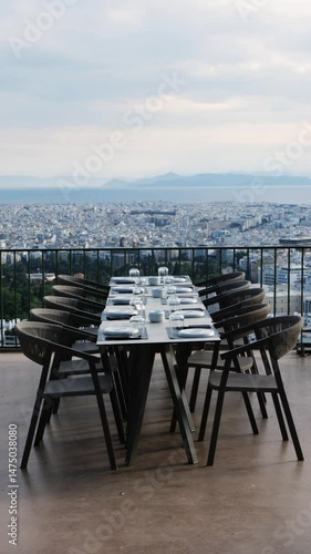 Wallpaper Mural One empty restaurant terrace on Lycabettus Hill in Athens, Greece, with a stunning view of city, no people, elegant outdoor dining spot with scenic panorama. Torontodigital.ca