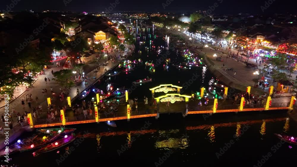 Aerial View of Hoi An Ancient Town at Night with Tourists, Lanterns, and Boats on River – Vietnam Travel Footage Aerial View of Hoi An Ancient Town at Night with Tourists, Lanterns, and Boats on River – Vietnam Travel Footage