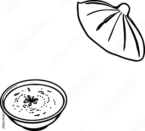 A Bowl of Yellow Soup with a Khinkali Lid Above