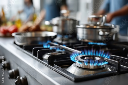 Flames dance on a gas stove as chefs prepare fresh ingredients in a modern kitchen filled with vibrant colors