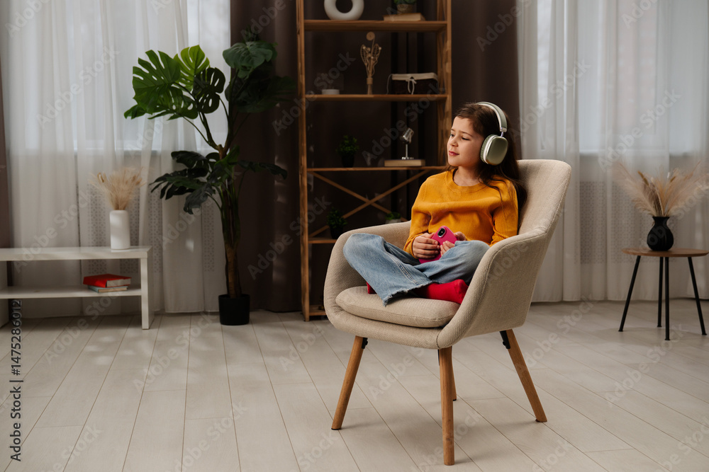 Obraz premium Young Girl Enjoying Music With Stylish Headphones