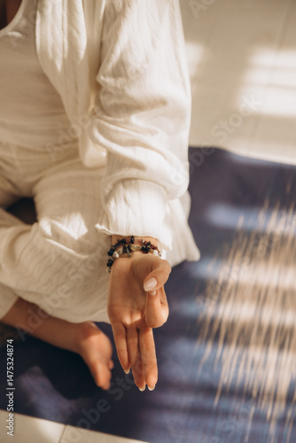 Woman hand in yoga symbolic gesture mudra