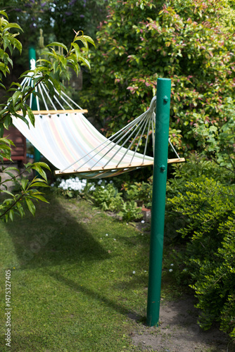 Obraz na płótnie Hammock, rest and recreation in the garden.
w salonie