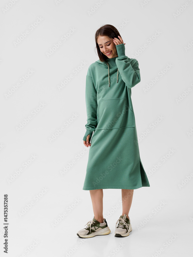 Pregnant girl model in stylish clothes on white background in studio. Pregnant girl model in stylish clothes on white background in studio.