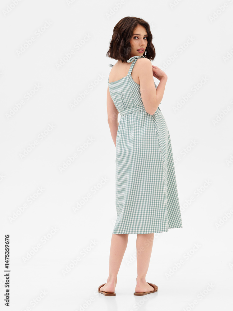 Pregnant girl model in stylish clothes on white background in studio. Pregnant girl model in stylish clothes on white background in studio.