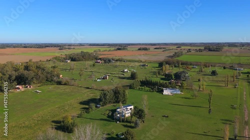 Aerial view from a drone of a beautiful sunny day of the countryside in the town of Carlos Keen in the province of Buenos Aires, Argentina.