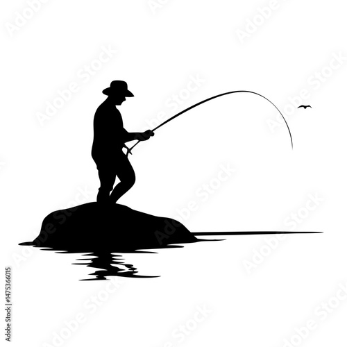 Silhouette of a fisherman in a hat on a rock by the water