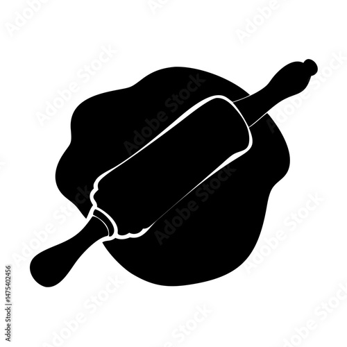 A rolling pin pressing down on dough to flatten it in the kitchen