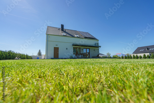 Obraz na płótnie Rear of new build fully detached house with solar panels w salonie