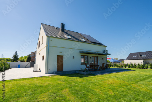 Obraz na płótnie Rear of new build fully detached house with solar panels w salonie