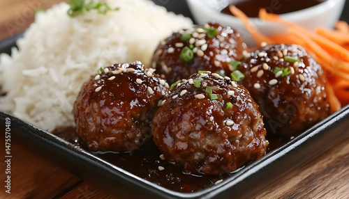 Obraz na płótnie Tasty meatballs with sauce and rice on wooden table, closeup w salonie