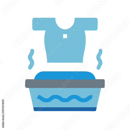 Washing clothes in a tub with hot water