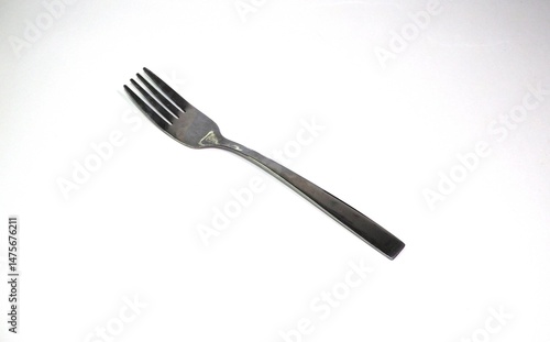Stainless steel fork isolated on white background, simple cutlery design for kitchen, dining, and restaurant use.