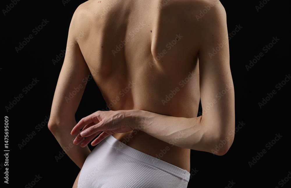 Naklejka premium Woman with perfect skin on black background, closeup