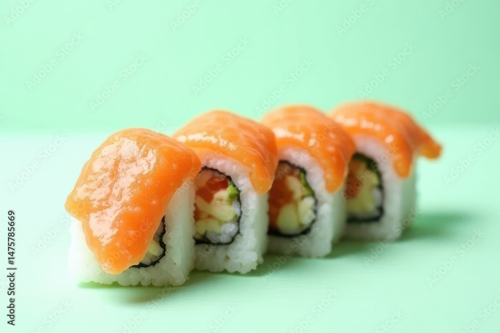 Minimalist Food Photography: Tempting Dragon Roll Sushi on Light Mint Background with Overcast Natural Light Minimalist Food Photography: Tempting Dragon Roll Sushi on Light Mint Background with Overcast Natural Light