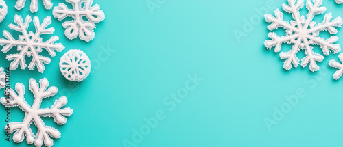 Wallpaper Mural Snowflakes on turquoise background create winter vibe Torontodigital.ca
