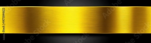 A brushed gold metallic horizontal stripe on a black background, reflecting light with a textured, shiny surface.