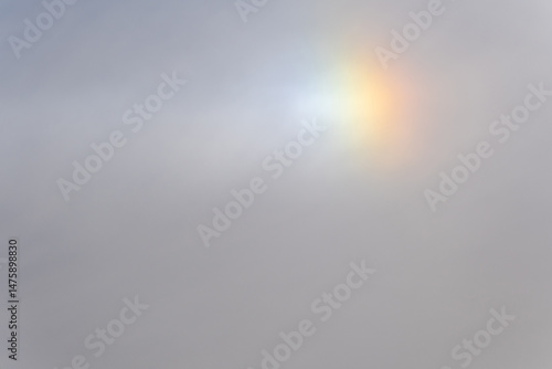 Rainbow flare light phenomenon in the daytime sky