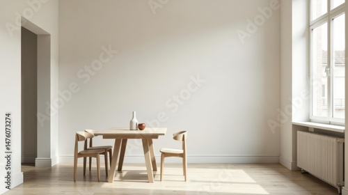 Minimalist dining area design with light wood table and chairs, showcasing a bright and airy interior