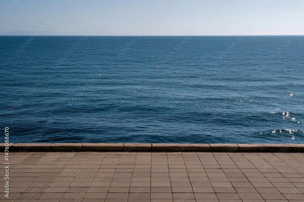 Obraz premium there is a man sitting on a bench looking out at the ocean