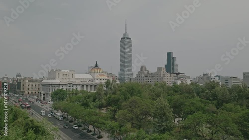 Drone flies over tree-lined avenue in Alameda Central