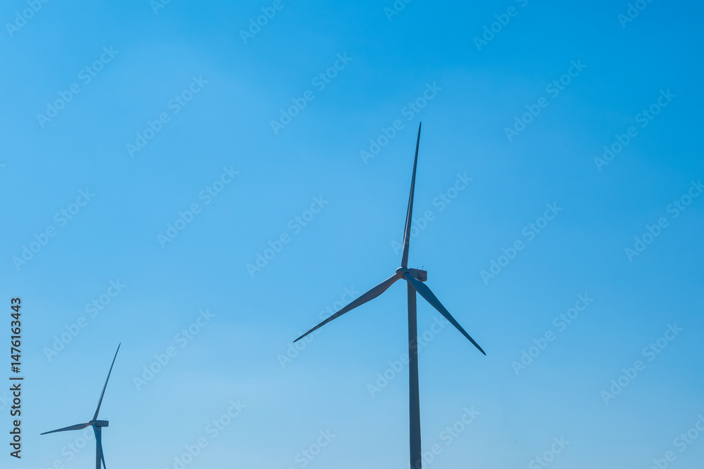 Wind farm on the mountain on blue sky day wind energy concept alternative energy Renewable energy
Wind farm on the mountain on blue sky day wind energy concept alternative energy Renewable energy