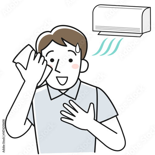 冷房で暑さをしのぐ笑顔の男性