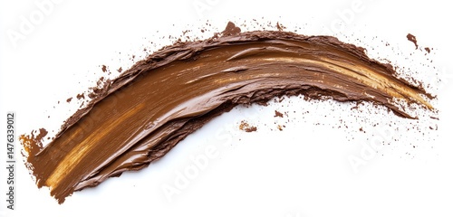 A swirled, creamy, rich brown cosmetic product smudge