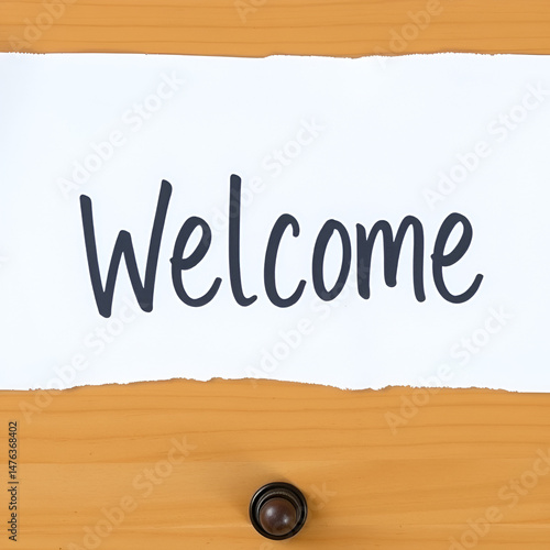 Writing note showing Welcome. Business concept for instance or analysisner of greeting someone in polite or friendly way Cardboard which is torn placed above a wooden classic table