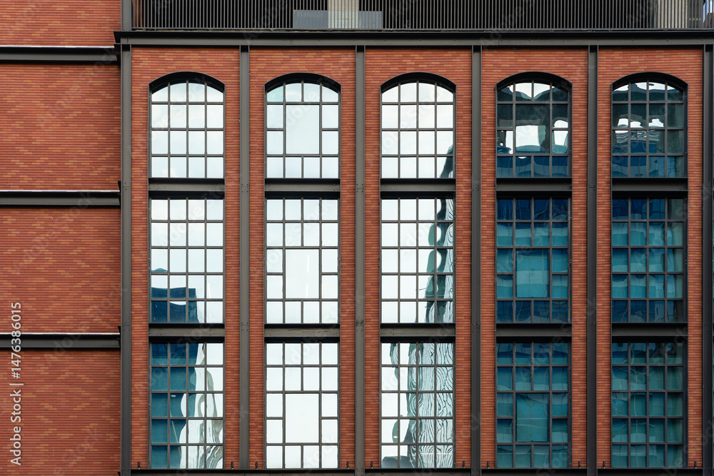 Obraz premium Vintage Brick Building with glass windows - Modern Architecture with Vintage Inspiration
