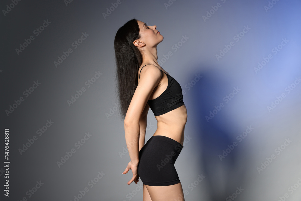 Obraz premium Beautiful woman with perfect slim body in studio