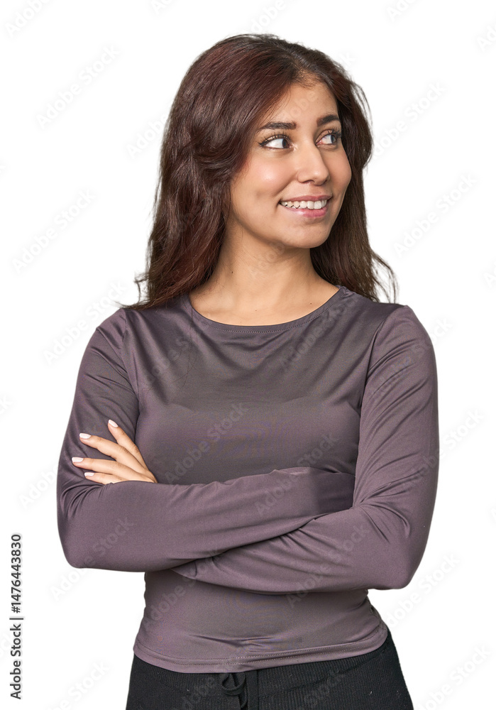 Middle Eastern woman in studio smiling confident with crossed arms. Middle Eastern woman in studio smiling confident with crossed arms.