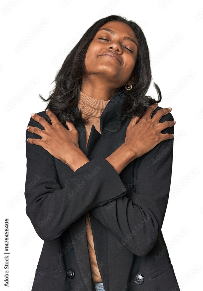 Young Indian woman in business suit hugs, smiling carefree and happy. Young Indian woman in business suit hugs, smiling carefree and happy.